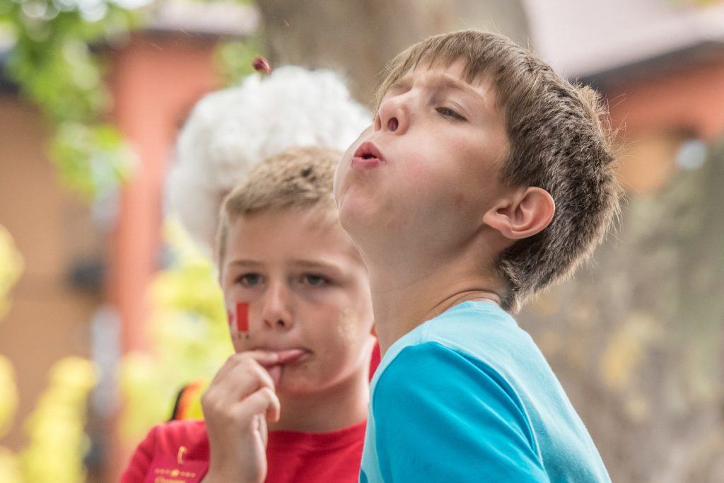 Gavin Cameron, 10, of Richmond fires a cherry pit into the air in the cherry pit spit contest. (Richard McGuire photo)