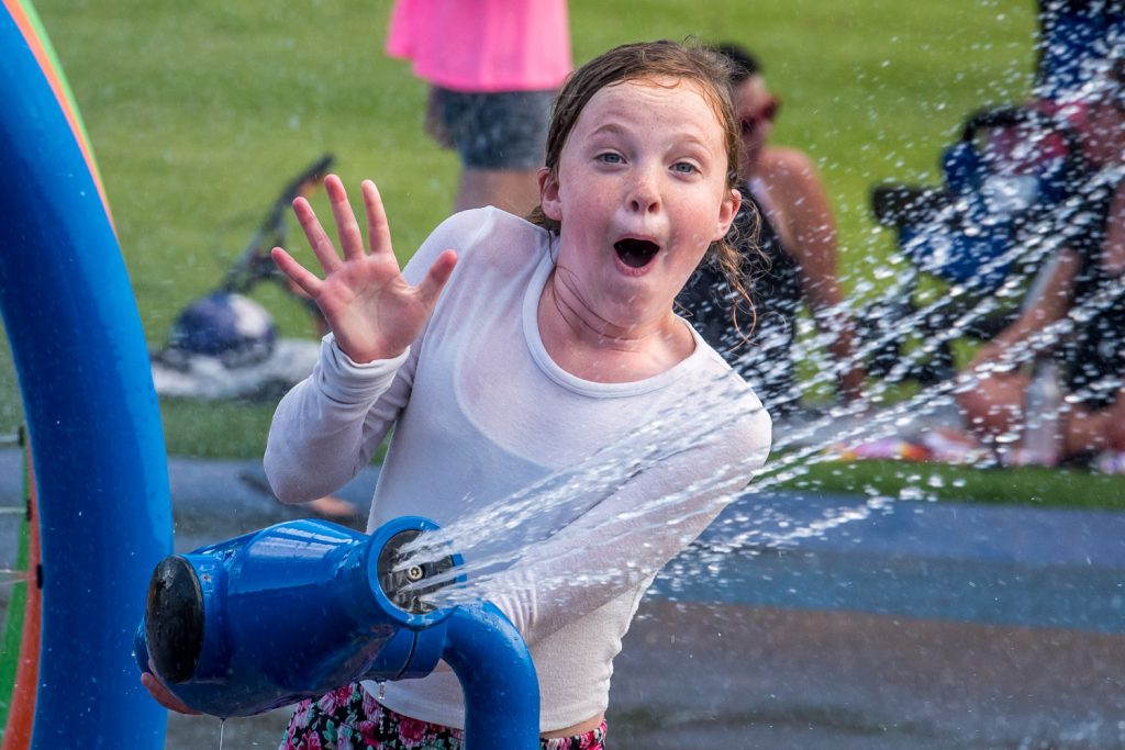 Charlotte King, 10, is surpised by a bolt of water as she tries to fire a cannon at the Osoyoos Splash Park. She's from Vancouver, but her family has a vacation property in Osoyoos. (Richard McGuire photo)