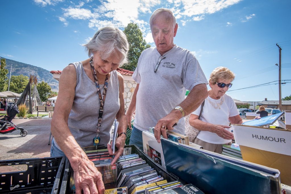 Pat and Eric Norman of Osoyoos were among the many book, CD and DVD bargain hunters at the annual Friends of the Library book sale on Saturday. The sale helps raise money for extra expenses the library faces that aren’t covered by its regular funding. Books are donated by members of the public. This year’s event raised nearly $1,400, about the same as last year. (Richard McGuire photo)
