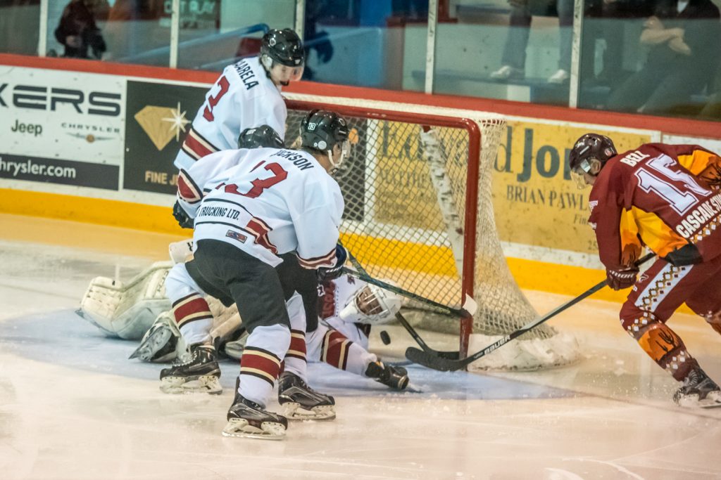 Colin Bell tips the puck into the net to score the Coyote's fourth goal early in the second period in their 8-0 victory Saturday night over the Princeton Posse. (Richard McGuire photo)