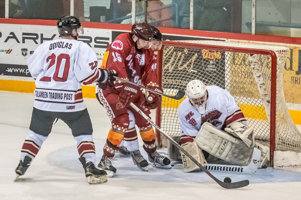 Princeton defenceman Rylan Douglas (No. 20) wasn't happy when Coyote Colin Bell parked in goalie Chandler Billinghurst's crease and tried to score. Bell wasn't successful this time, but he did score two goals. (Richard McGuire photo)