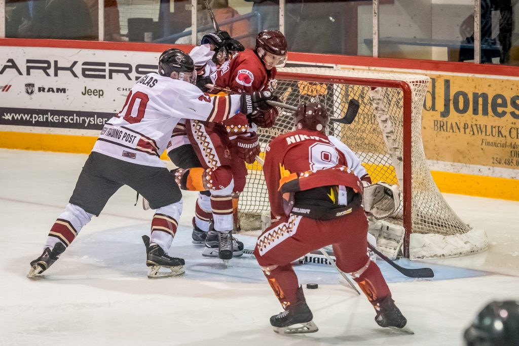 Princeton defenceman Rylan Douglas (No. 20) wasn't happy when Coyote Colin Bell parked in goalie Chandler Billinghurst's crease and tried to score. Bell wasn't successful this time, but he did score two goals. (Richard McGuire photo)