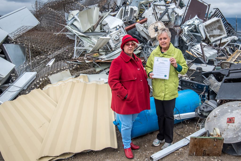 Mayor Sue McKortoff (right) signed a proclamation last week to declare the week of Oct. 17 - 23 as Waste Reduction Week in Canada in the Town of Osoyoos. And what better location to deliver her message than the Osoyoos Landfill Site, accompanied by scale clerk Jill Beck. The two posed by a pile of scrap metal as McKortoff spoke about the need to recycle -- or better yet, reduce waste in the first place or reuse items. (Richard McGuire photo)