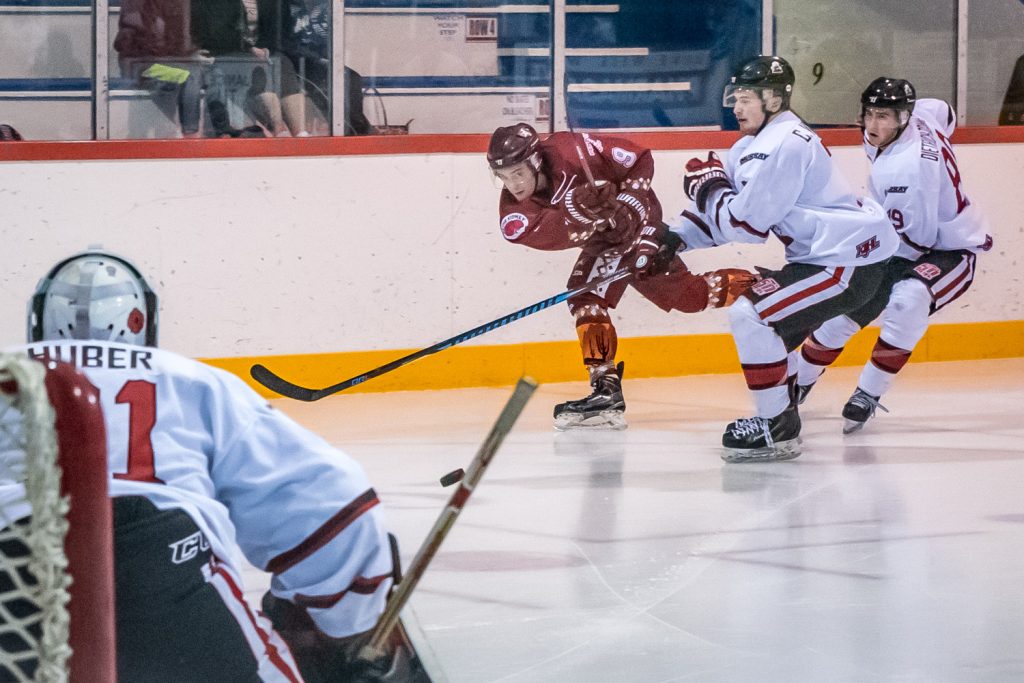 Carter Shannon fires the puck on Summerland goalie Matthew Huber Friday night. Shannon didn't score this time, but he did get two goals and two assists and was named first star of the game. The Osoyoos Coyotes humiliated the division-leading Steam 5-1. (Richard McGuire photo)