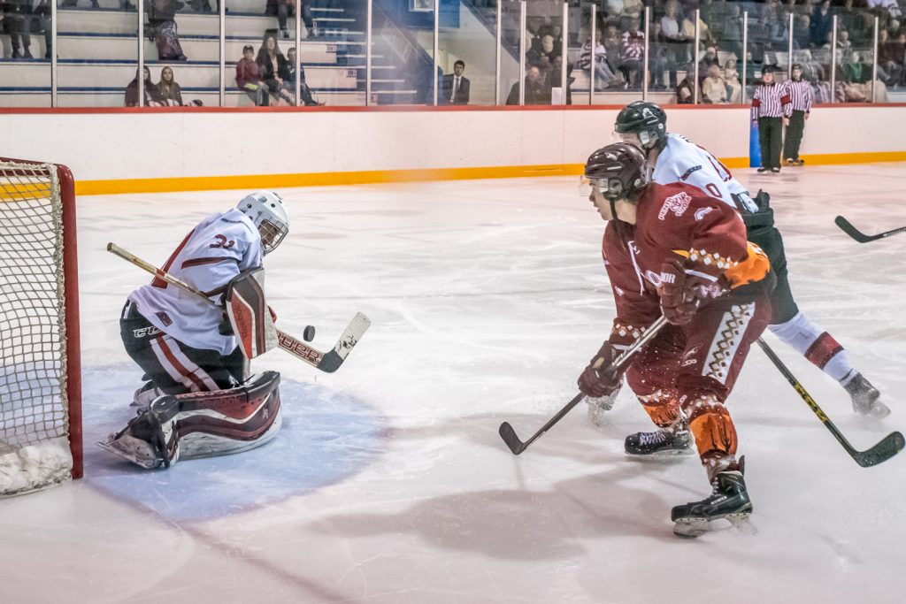 Carter Shannon swoops in on Summerland goalie Matthew Huber Friday night. Shannon didn't score this time, but he did get two goals and two assists and was named first star of the game. The Osoyoos Coyotes humiliated the division-leading Steam 5-1. (Richard McGuire photo)