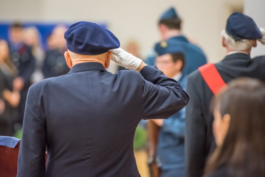 Dr. Robert Ritchie (left) and Sergeant-at-Arms Lew Taylor give a salute to their fallen comrades during Friday's Remembrance Day service at the Sonora Community Centre. (Richard McGuire photo)