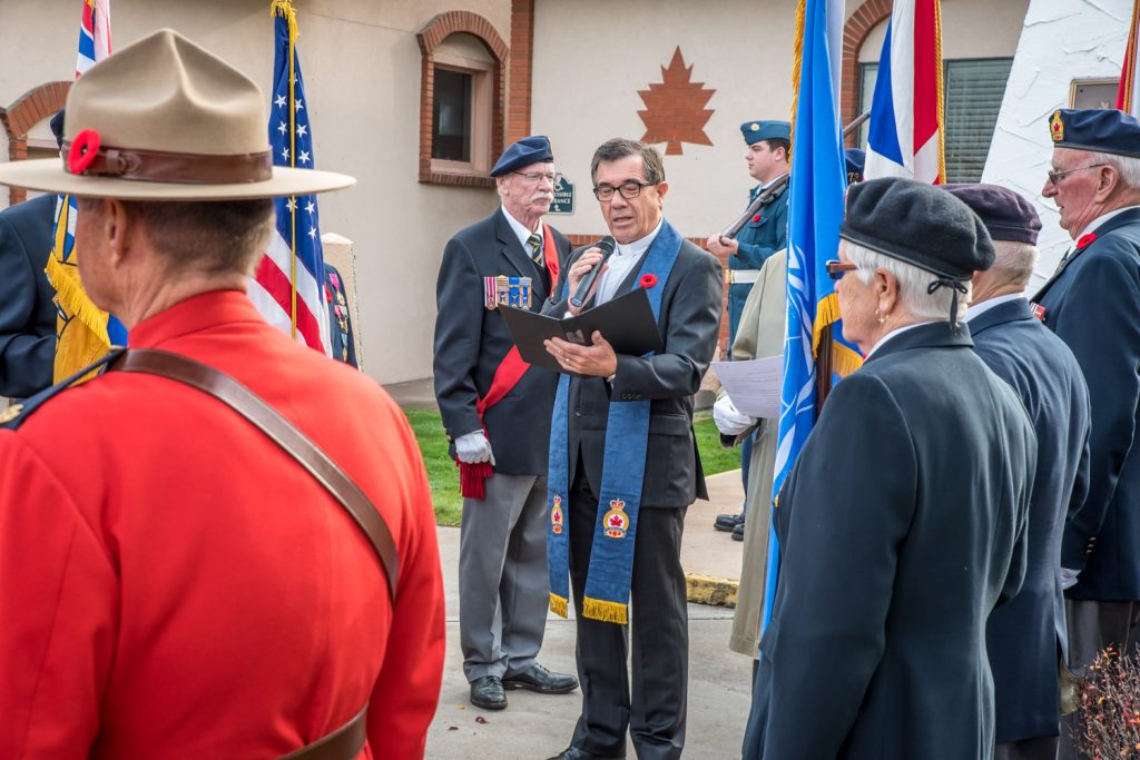 Rev. Steve Hershey reads a prayer at the start of a smaller Remembrance Day service at the Osoyoos cenotaph. (Richard McGuire photo)
