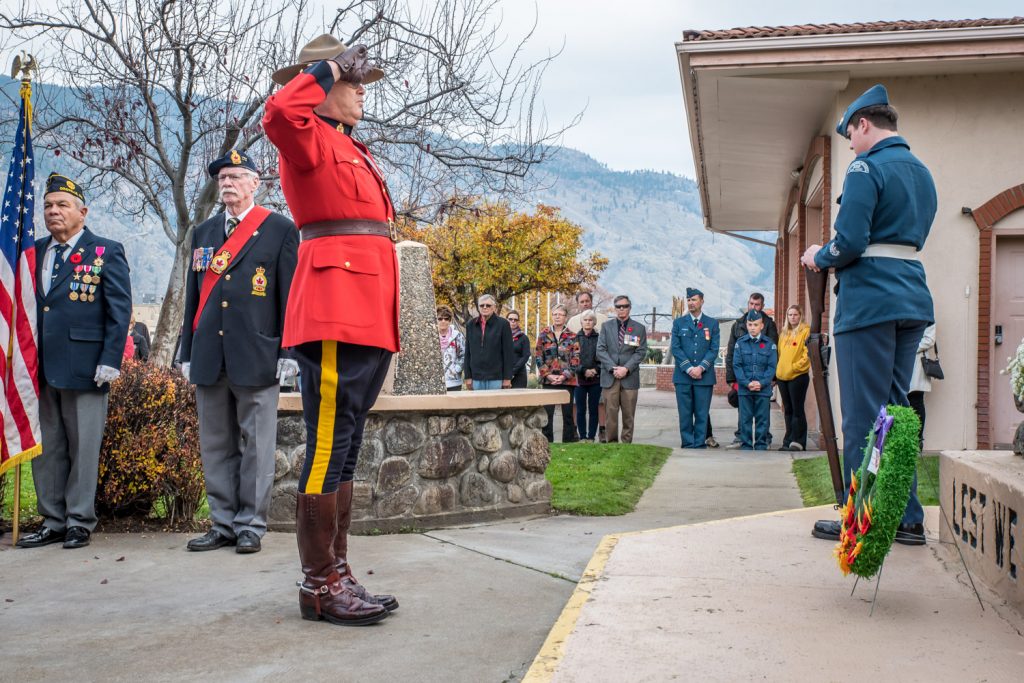 Saluting after the laying of a wreath on behalf of the Queen. (Richard McGuire photo)