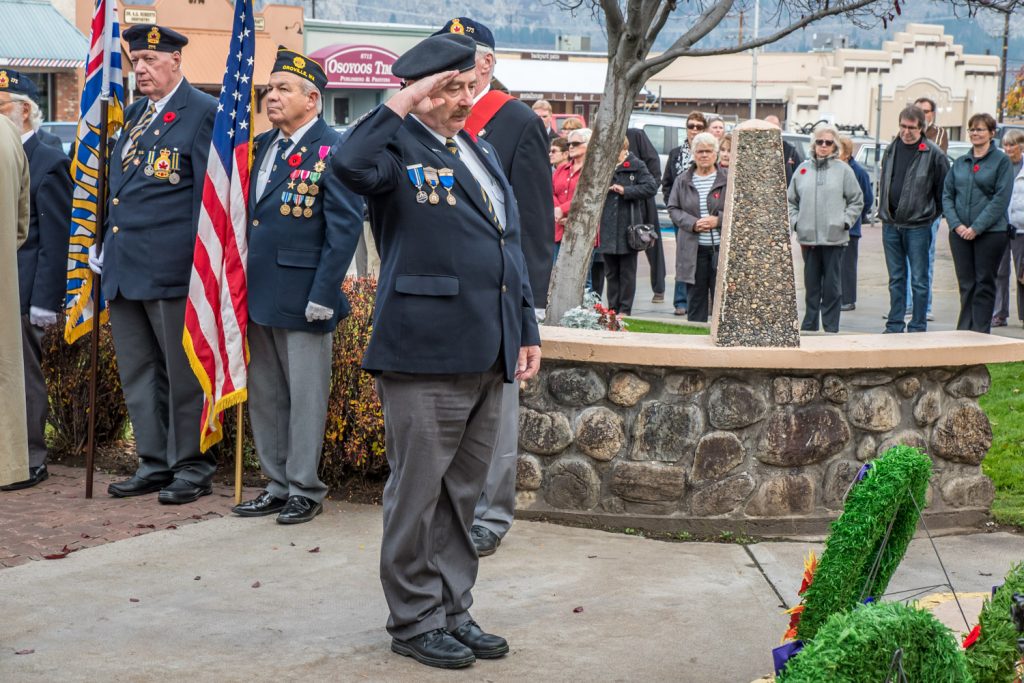 Osoyoos Royal Canadian Legion Branh 173 president Bruce Davies salutes after laying a wreath at the cenotaph. (Richard McGuire photo)