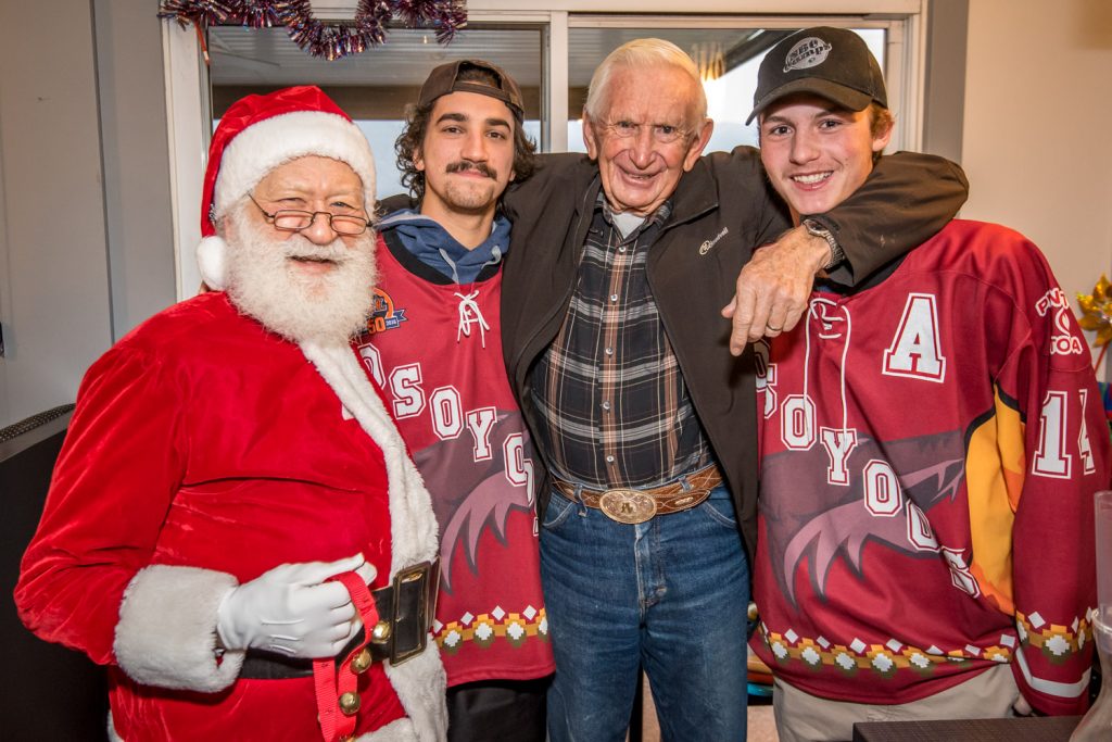 Al Schultz of Osoyoos was joined for a photo by Santa Claus and Osoyoos Coyotes Judd Repole and Jackson Glimpel at Smitty's Family Restaurant. Once again the restaurant held its popular Toys for Tots to Teens event Friday morning, giving free breakfast to those who donated a toy or cash for the Kiwanis "Share the Christmas Spirit" program. (Richard McGuire photo)