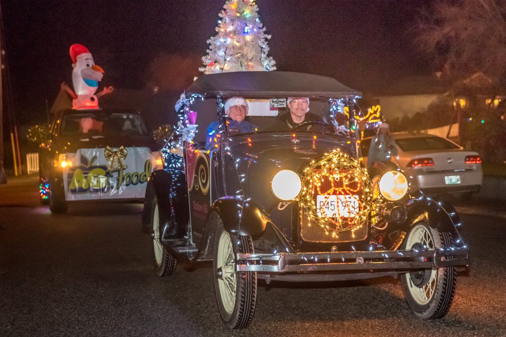 Antique and fancy cars were part of the Santa Parade Friday evening during Christmas Lite-Up. (Richard McGuire photo)