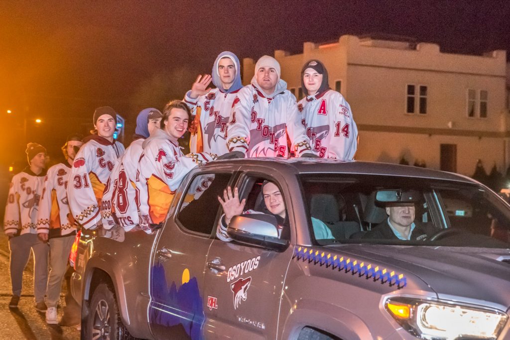 The Osoyoos Coyotes wore their jerseys during the Santa Parade at Christmas Lite-Up. We're not sure how they decided which players got to ride the truck and which had to walk. (Richard McGuire photo)