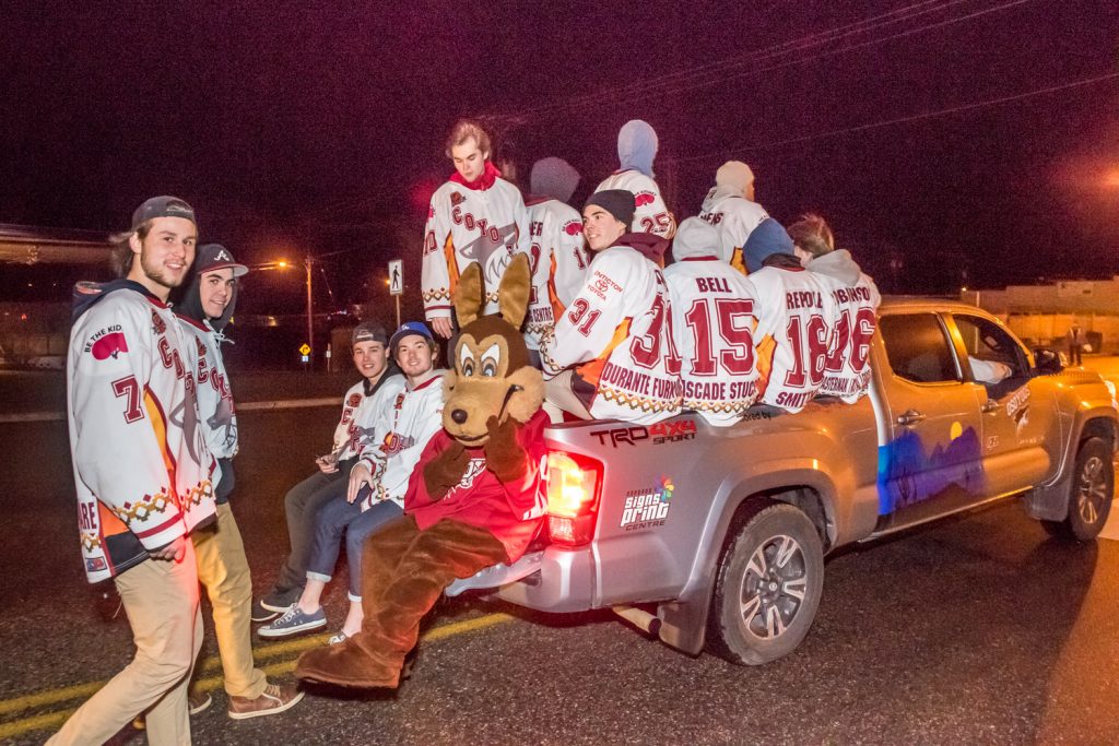 The Osoyoos Coyotes wore their jerseys during the Santa Parade at Christmas Lite-Up. We're not sure how they decided which players got to ride the truck and which had to walk. (Richard McGuire photo)