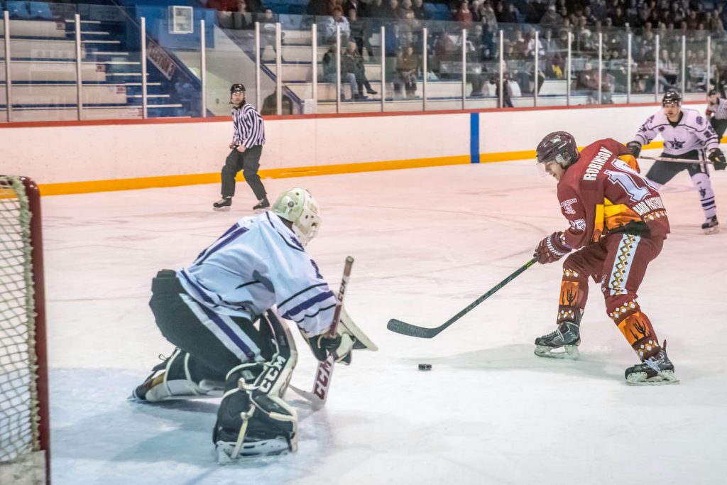 Carter Robinson of the Coyotes saw an opening and skated in on North Okanagan goalie Daniel Paul to score the first goal of Wednesday night's game. (Richard McGuire photo)