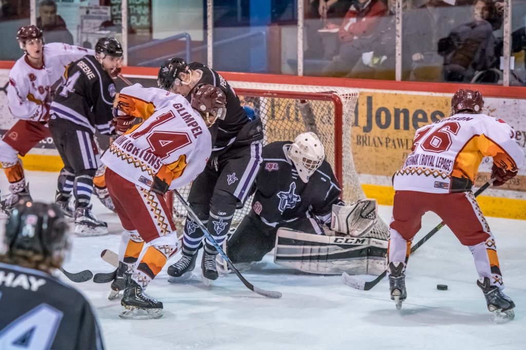 The Osoyoos Coyotes keep up the pressure on North Okanagan goalie Daniel Paul during the second period Saturday night. The Coyotes won 6-4. (Richard McGuire photo)