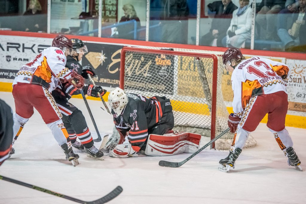 Hunter Johnson (left) and Sam Reinbolt make Kelowna goalie Tanner Marshall work hard in the second period. (Richard McGuire photo)