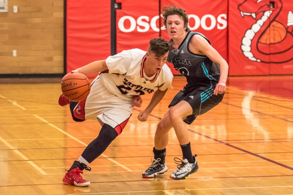 Justin Davis runs around an opponent to advance with the ball. (Richard McGuire photo)