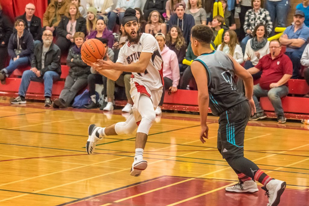 Kavneer Dhaliwal is in the air as he prepares to throw the ball. (Richard McGuire photo)