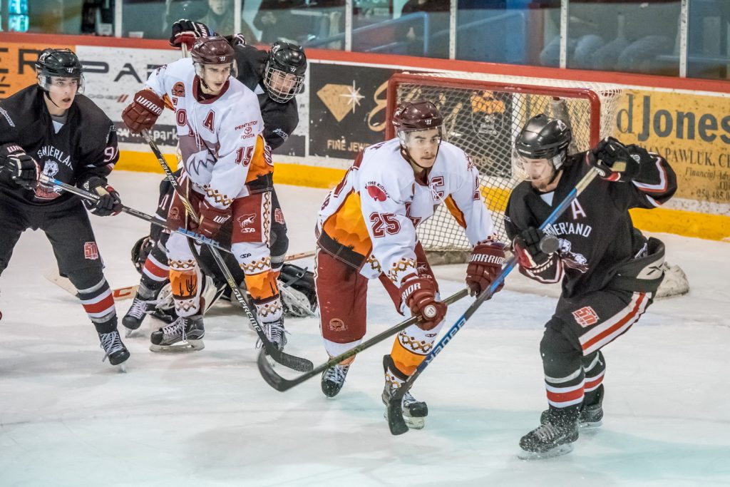 Colin Bell (15) and Daniel Stone (25) keep up the pressure in Summerland's end as the Coyotes outshot the Steam 19-7 in the second period Tuesday, but neither team scored. (Richard McGuire photo)