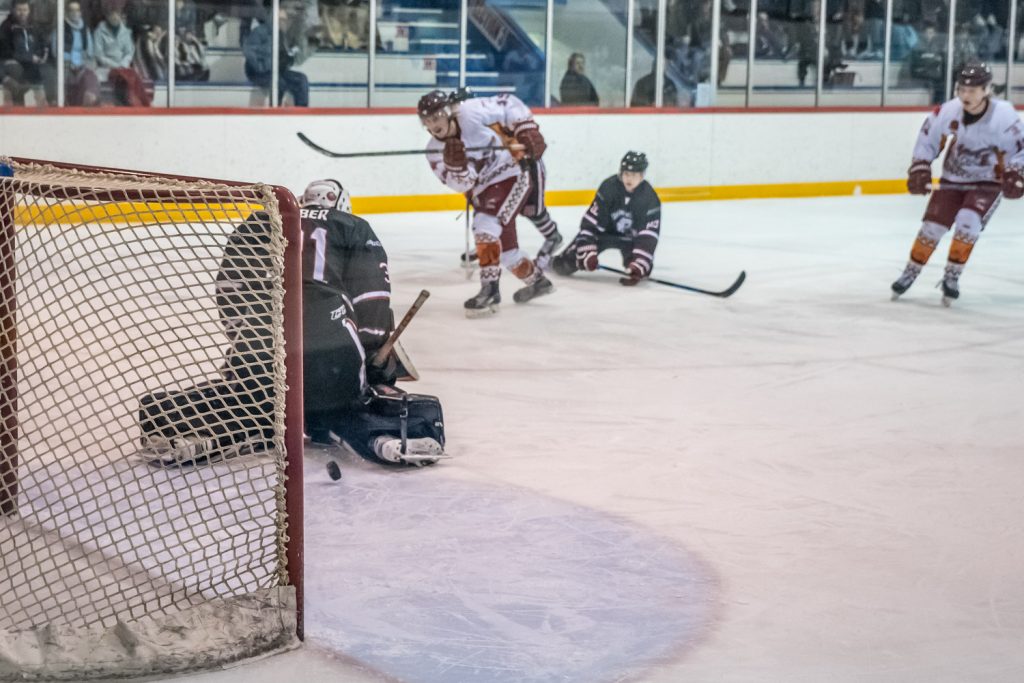 Connor Onstein fires the puck through the legs of Summerland goalie Matthew Huber to score the first goal of Wednesday night's game. (Richard McGuire photo)