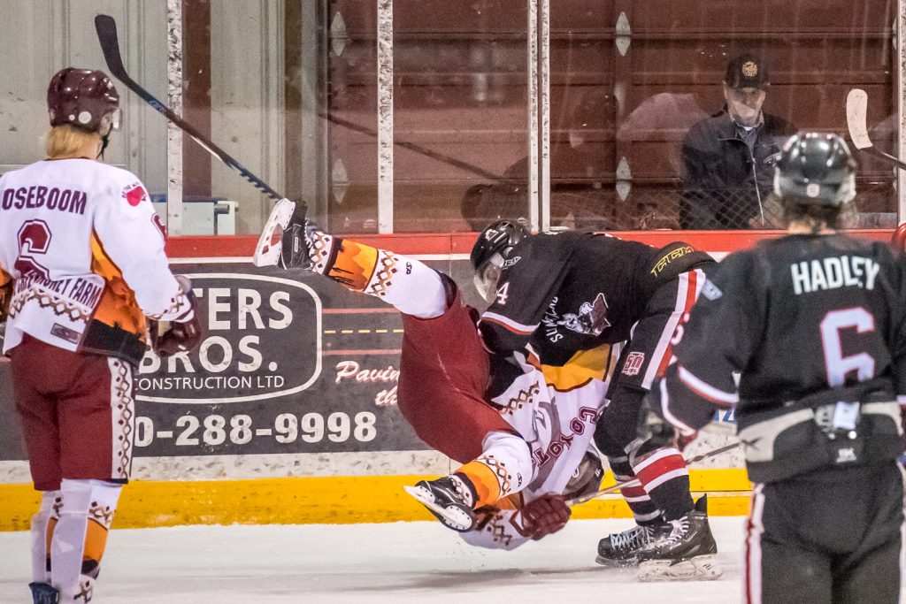 Summerland goon Michael MacLean appears to pick up and toss Mackenzie Wiens. Referee Bobby Williamson appeared to be watching another scuffle at the time and there were no penalties. MacLean did, however, get head contact and misconduct penalties for another incident. MacLean, who is 6 ft. 6 in. and weighs 245 lb. had 187 minutes in penalties during the regular season in 36 games played. (Richard McGuire photo)
