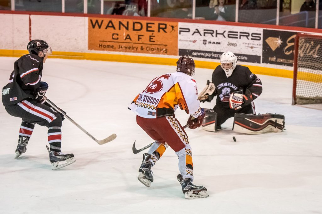 Colin Bell moves in on Summerland goalie Matthew Huber, but Huber managed to stop the puck. (Richard McGuire photo)