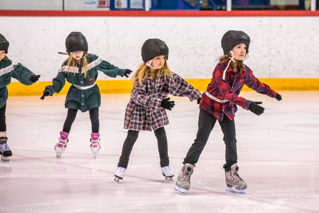 Children in the Canskate Blue group skate to Cotton Eye Joe. (Richard McGuire photo)