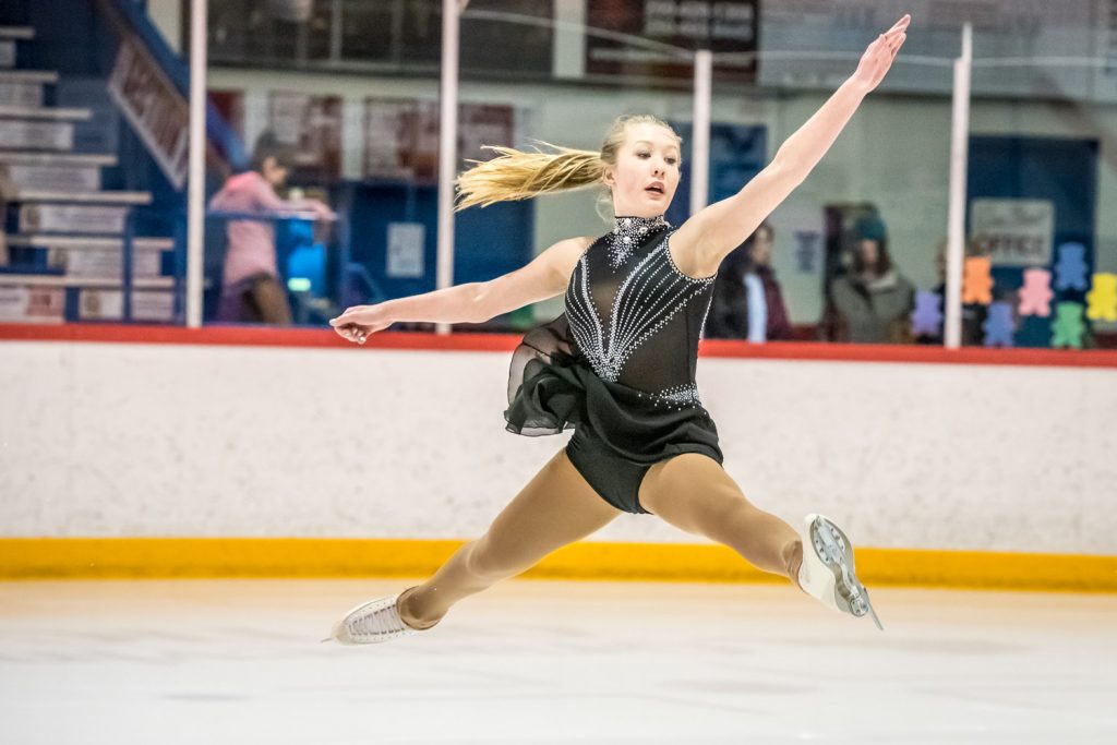 Emily Stewart is shown here taking a flying leap in her solo performance. She is in the Star 9 Competition Short Program. (Richard McGuire photo)