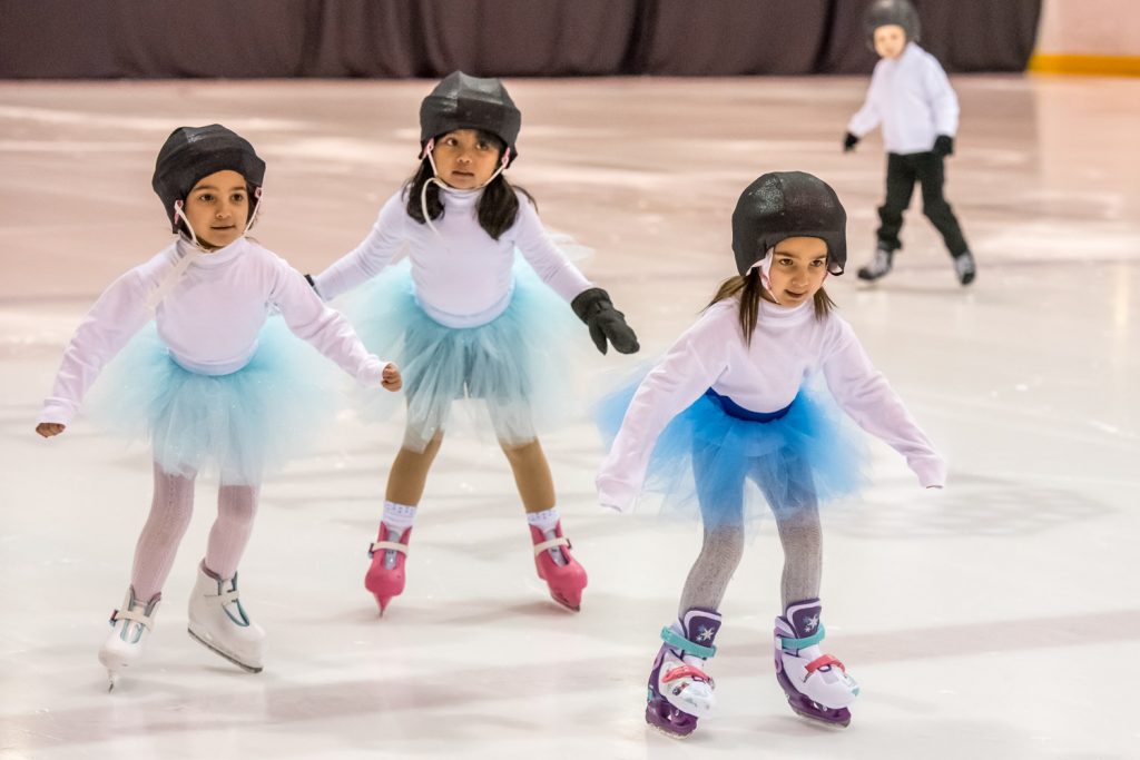 Children in the Canskate Red group skate to The Twist. (Richard McGuire photo)