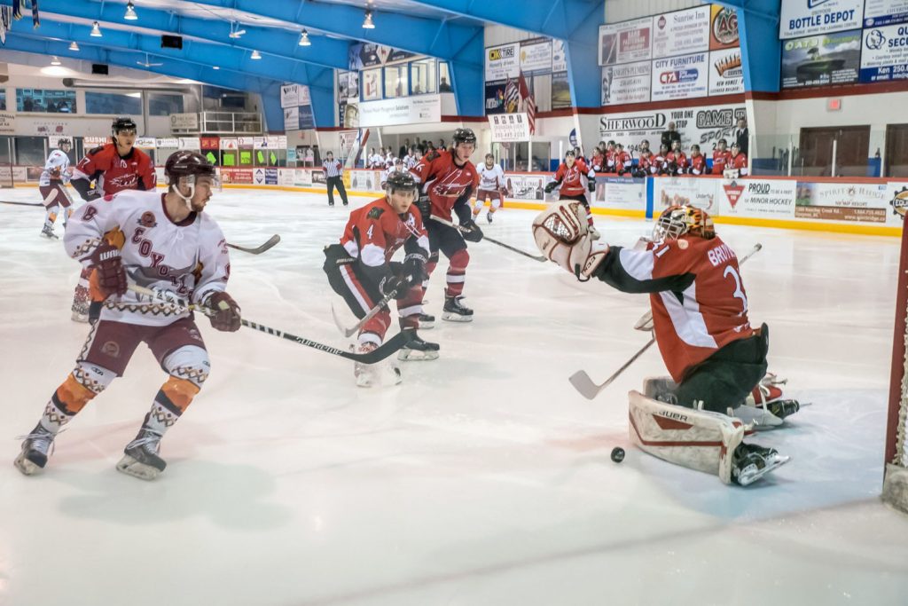 Colton Rhodes moves in for a loose puck in front of Chase goalie Nic Bruyere. A second later, the puck was in the net and the Coyotes led Saturday's game 1-0. (Richard McGuire photo)