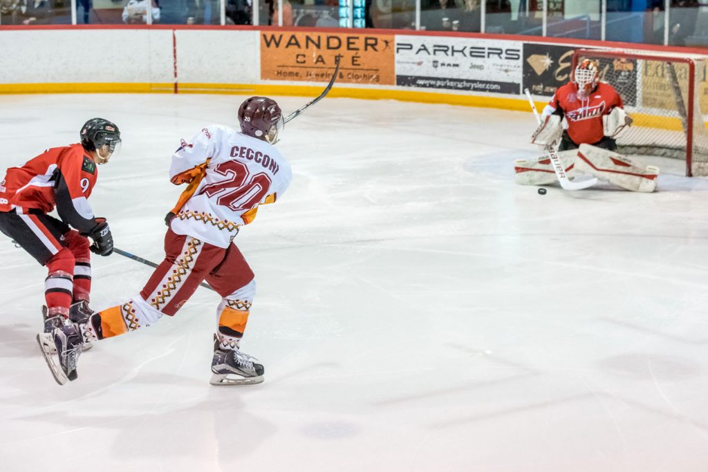 Bryson Cecconi skated in to shoot the puck through the legs of Chase goalie Nic Bruyere, scoring the Coyotes' second goal, tying the game, early in the second period. (Richard McGuire photo)