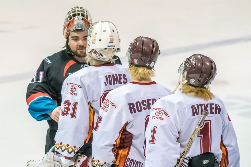 Nic Bruyere (left) the Chase goalie who played such a big role in the Coyotes' defeat is congratulated by Adam Jones, who performed excellently in net for the Coyotes this playoff season. Behind are Coyote star Adam Roseboom and backup goalie Liam Aitken, who played in the second game against Chase. (Richard McGuire photo)