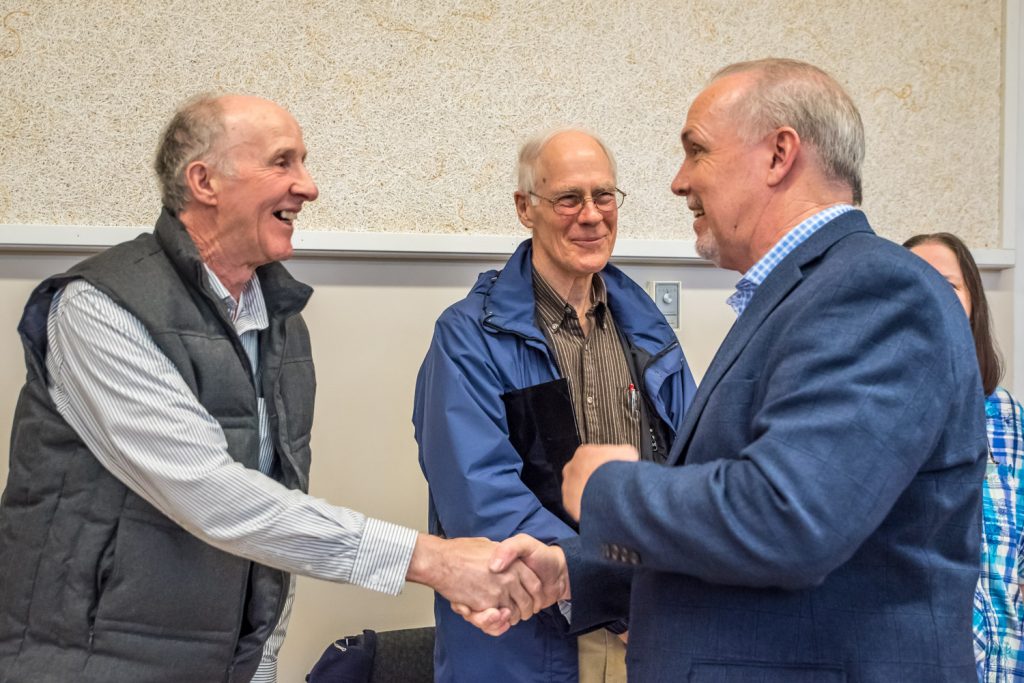 Osoyoos resident Sy Murseli (left) greeted NDP Leader John Horgan as he arrived at the Sonora Community Centre. Behind are local residents Michael Ryan and Cathie Baskett. (Richard McGuire photo)