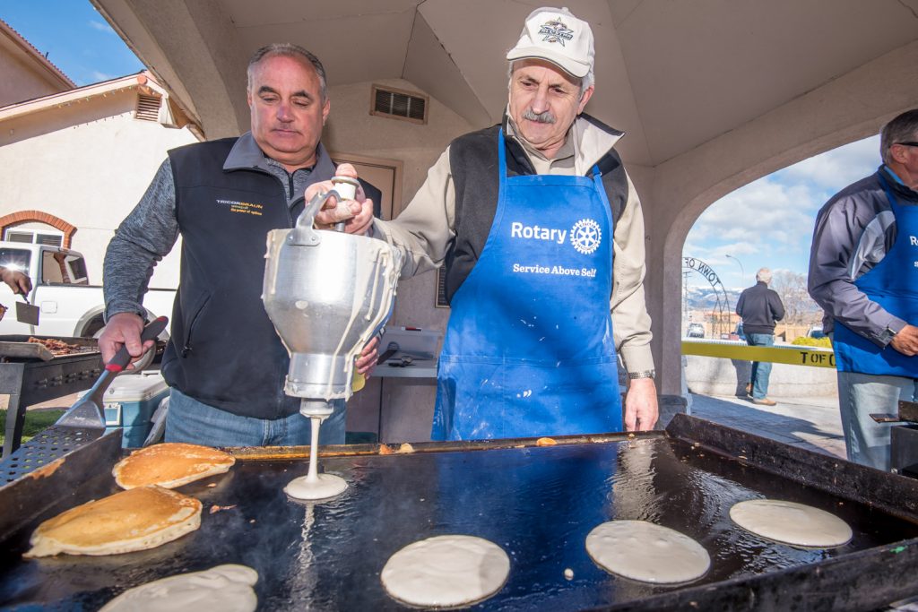 At the Rotary Pancake breakfast, the efficiency is all about specialzation. And Jim King's specialty is pancake making. As the Rotarian and Osoyoos town councillor lets out just the right amount of batter, Rob Summers (left) stands by ready to flip them so they are golden brown. (Richard McGuire photo)