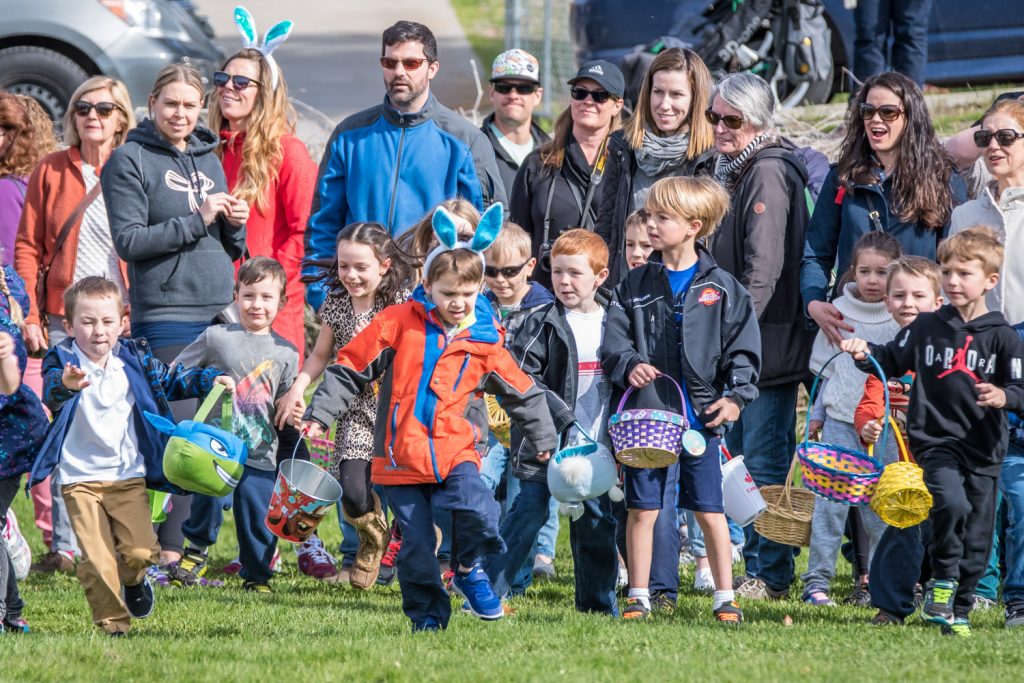 It was a bit of a staggered start at the Easter egg hunt as some children were sure they heard the word "go," and others didn't. It took mere seconds though for swarms of children to grab every one of the thousands of candy Easter eggs, and a few special plastic ones, scattered across the playground. (Richard McGuire photo)