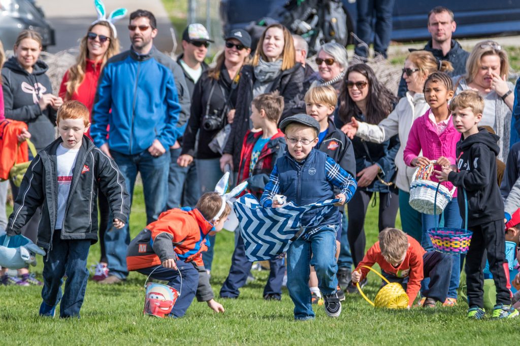 It was a bit of a staggered start at the Easter egg hunt as some children were sure they heard the word "go," and others didn't. It took mere seconds though for swarms of children to grab every one of the thousands of candy Easter eggs, and a few special plastic ones, scattered across the playground. (Richard McGuire photo)
