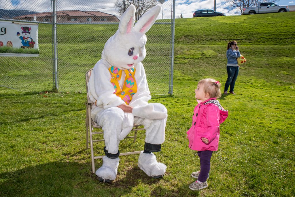 Andi Pawluk, 17 months old, got up the nerve to check out the Easter Bunny after the egg hunt. Other less brave toddlers screamed in terror when they met the giant wascally wabbit. (Richard McGuire photo)