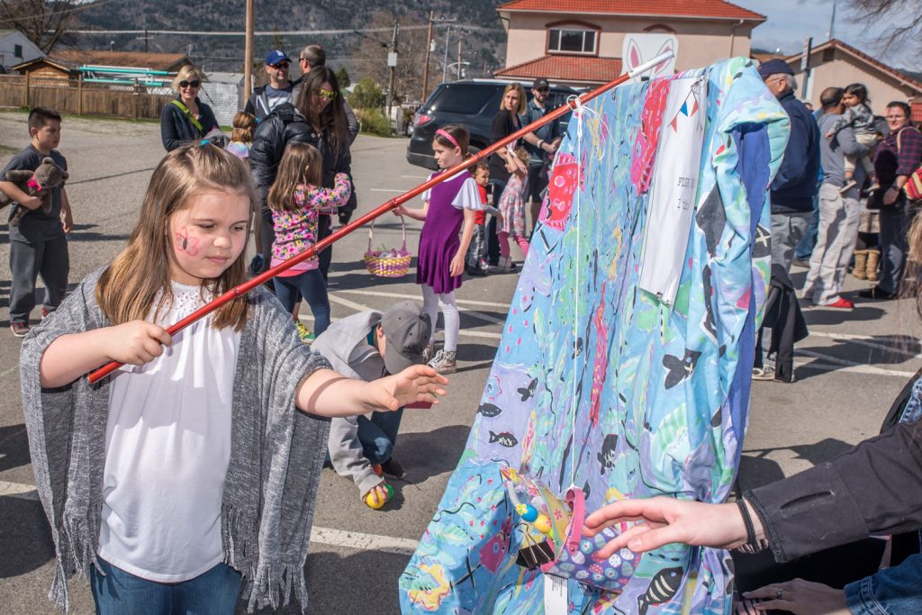 Addison Markosic, 7, from Surrey was in Osoyoos visiting family when she landed a "fish" at the Easter Eggstravaganza fish pond. (Richard McGuire photo)