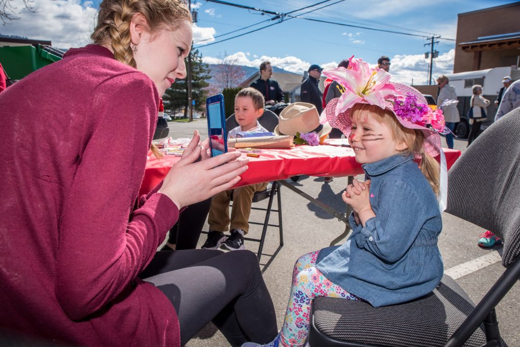 Victoria Hesketh, 2, takes a look in the mirror after Princess Laura Devries painted her face. She's from Salmon Arm and was visiting grandparents in Osoyoos. (Richard McGuire photo)