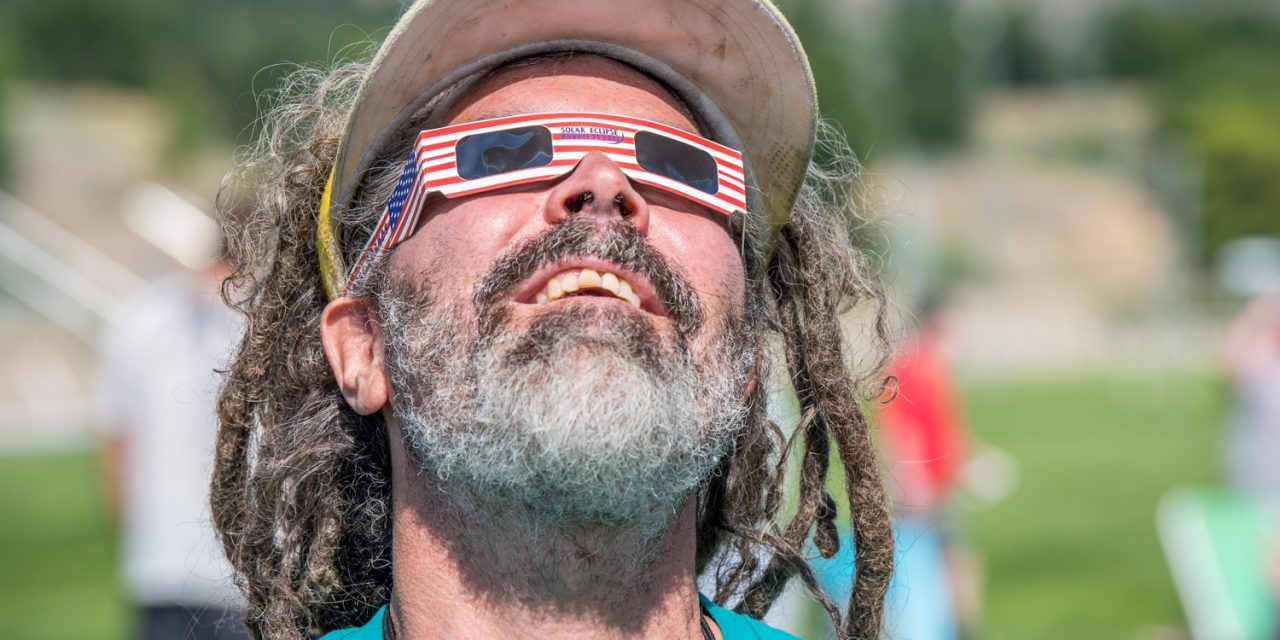 Viewing glasses in short supply, but people share, improvise to watch eclipse at Desert Park