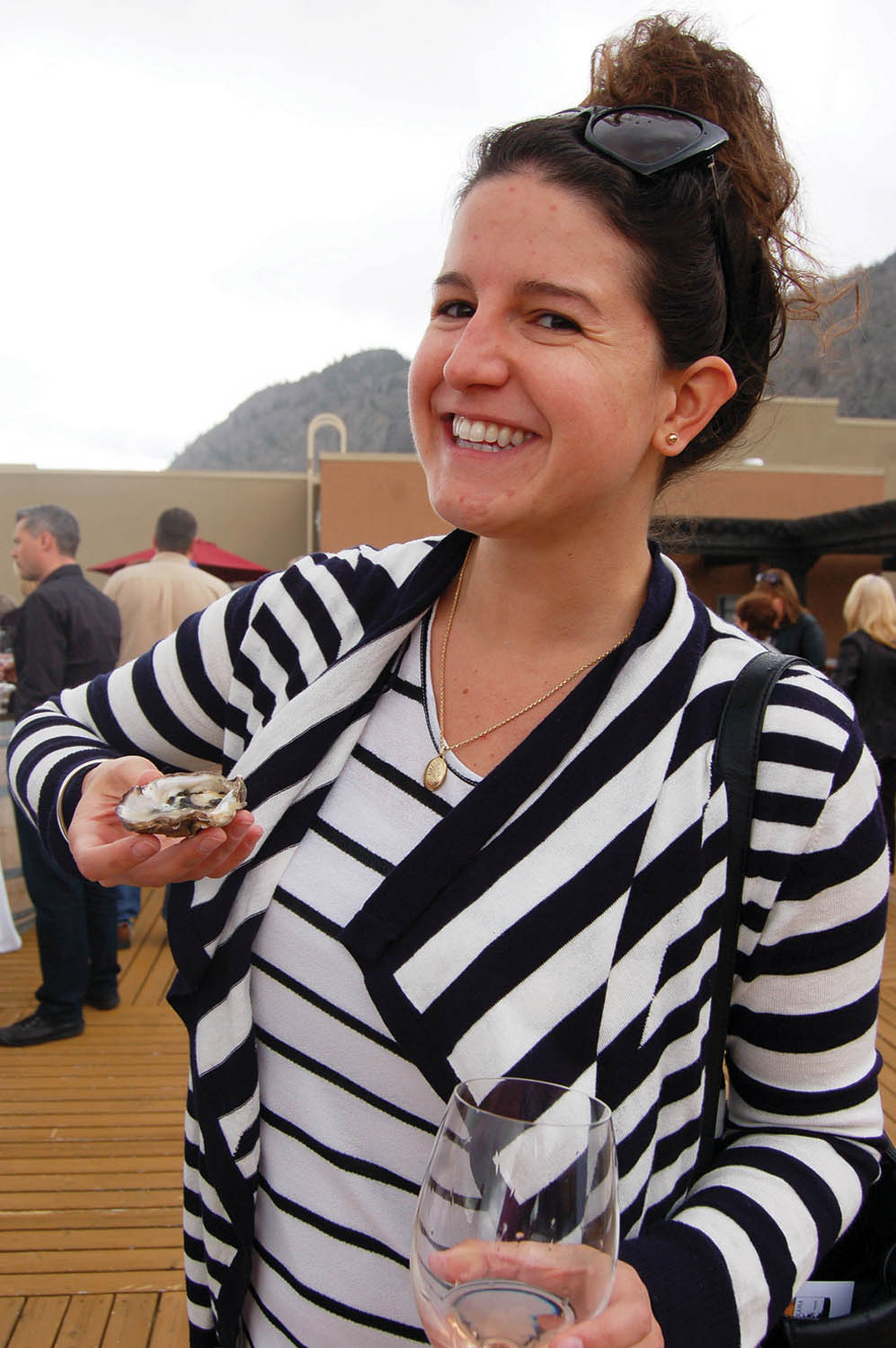 Crystal Hansen prepares to enjoy her oyster prepared by Jack Crofts of Codfathers Seafood Market in Kelowna, during the ‘Get Shucked’ oyster and wine pairing competition at Sprit Ridge on April 26. (Erin Christie photo)