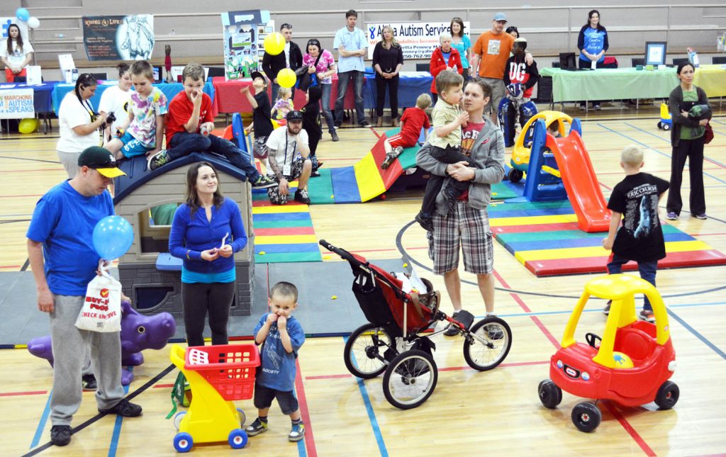 Parents and children had fun in the Sonora Community Centre gymnasium prior to the Osoyoos Autism Behavioural Centre's Walk for Awareness. (Lyonel Doherty photo)