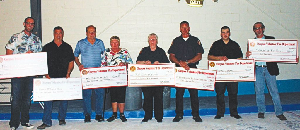 The annual Osoyoos Volunteer Firefighters Oyster Feed attracted another sold-out crowd to the Osoyoos International Curling Club this past Saturday evening. Hundreds of local residents and visitors gathered to eat some oysters and other fine food, have a couple of drinks and dance the night away. The event raises a significant amount of money for various worthy causes in Osoyoos and across the province. Cheques were handed out to numerous organizations on Saturday evening. They included (from left) Brock Johnson on behalf of the Have a Heart Telethon; Town of Osoyoos Director of Financial Services Jim Zakall on behalf of Ronald McDonald House; Cor and Gloria Vermeulen on behalf of the regional MS Society; Eileen Varga on behalf of the BC Cancer Society; Wyatt Thompson on behalf of the Burn Unit at Vancouver General Hospital; Blake Loura, who received a bursary; and Town of Osoyoos Councillor Mike Campol, the founder of Spirit of the Game, which helps provides funds so local children can participate in minor sports and recreational activities. Total funds raised from this year’s event was $18,500. Further donations will be made later in the year. (Photo supplied)