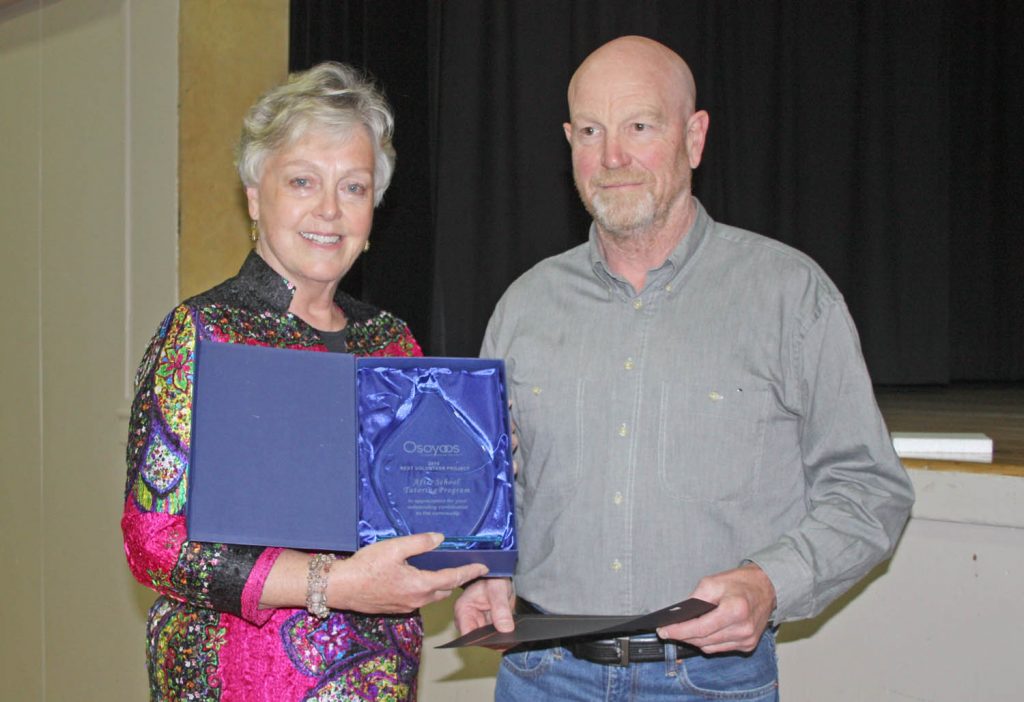 Mayor Sue McKortoff presents the Best Volunteer Project Award to David Adamson, volunteer co-ordinator with the School After School Tutoring Program. (Keith Lacey photo)