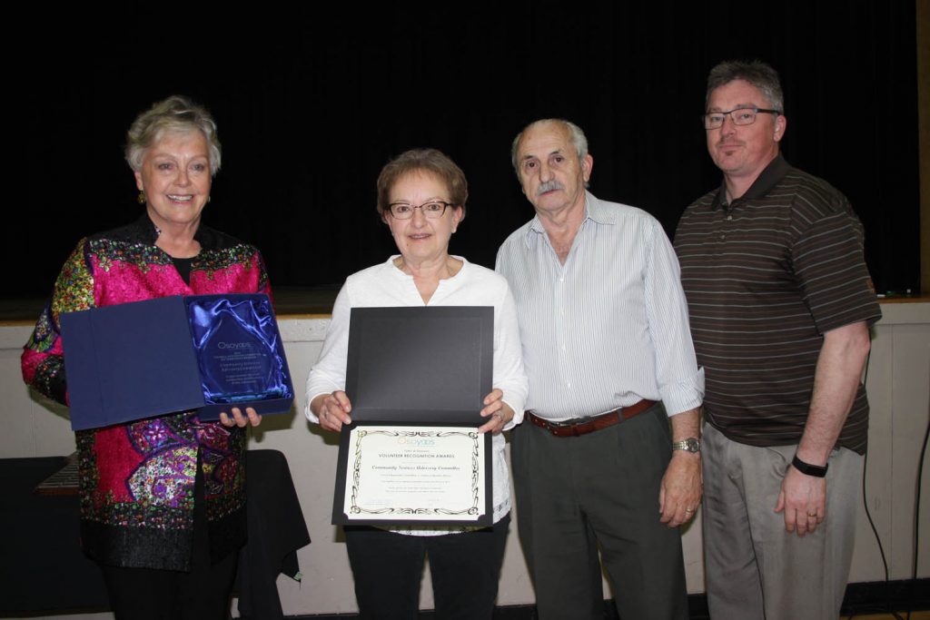 Mayor Sue McKortoff presents the award for Council Appointed Committee or Taskforce members to the Community Services Advisory Committee. From left after McKortoff are Carol Nesdoly, Coun. Jim King and Gerald Davis, director of community services. (Keith Lacey photo)