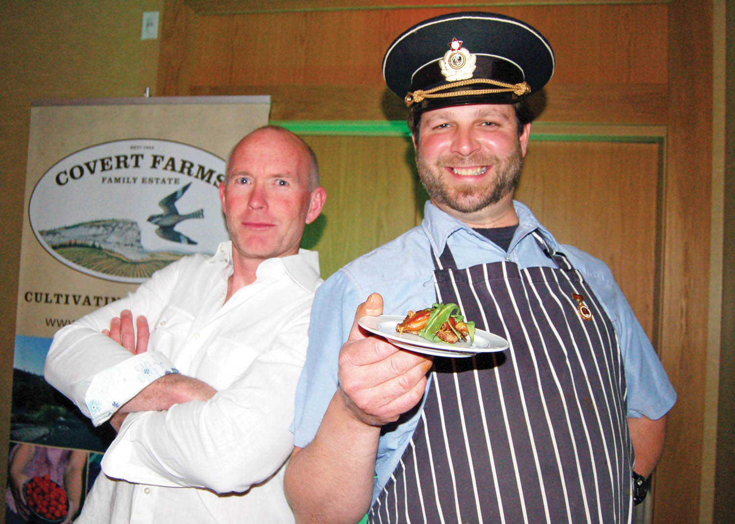 Gene Covert (left) and Derek Uhlemann of Covert Farms show off a cane smoked Thetis Island oyster, which they served with Covert’s signature Sauvignon Blanc at the Art of the Oyster Pearl Gala at the Watermark Beach Resort on April 26. The event capped off a series of Osoyoos Oyster Festival events showcasing local wines, beers and chefs with oysters from the coast. (Erin Christie photo)