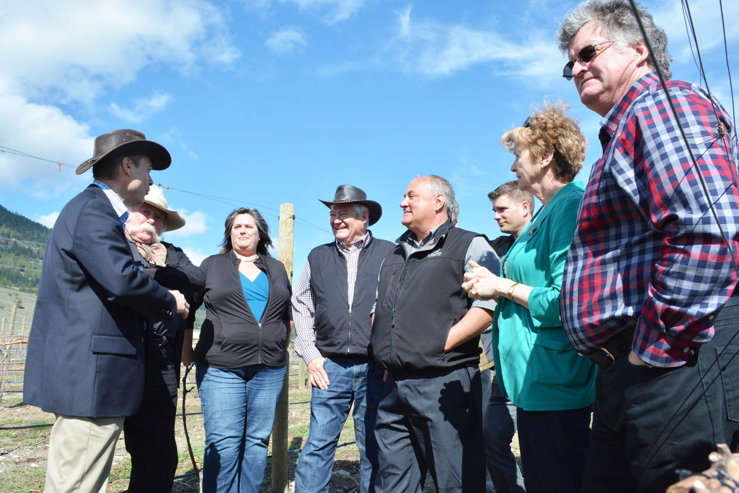 Agriculture Minister Norm Letnick (left) talks to local winery owners and winemakers during a recent announcement on the new sub-geographical recognition for the Golden Mile Bench and its 11 wineries. Next to Letnick are (from left) Bruce Fuller from Rustico Farm and Cellars, Sandra Oldfield from Tinhorn Creek Vineyards, Don Triggs from Culmina Family Estate Winery, Rob Summers from Hester Creek Estate Winery, Derek Kontkanen from Inniskillin Okanagan Vineyards, Boundary-Similkameen MLA Linda Larson, and Bill Eggert from Fairview Cellars. (Lyonel Doherty photo)