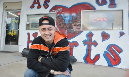 Business owner covers up artwork after bylaw infraction