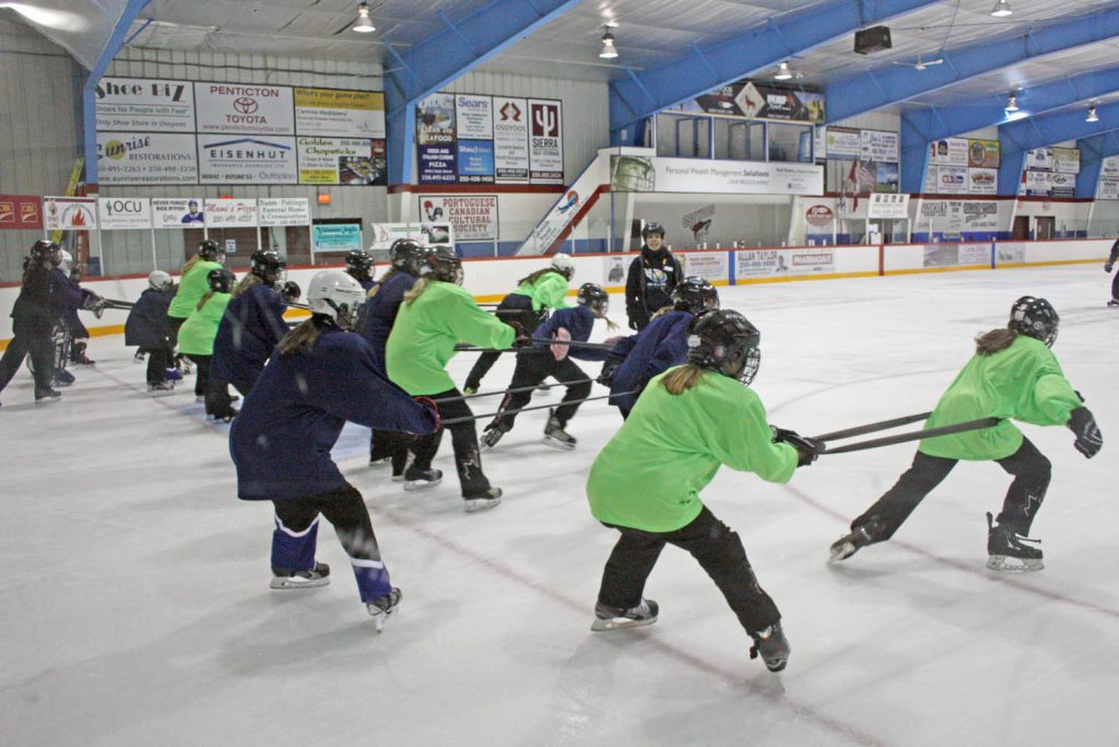 Participants in the Osoyoos Summer Ringette Camp team up to work on their skills. (Keith Lacey photo)