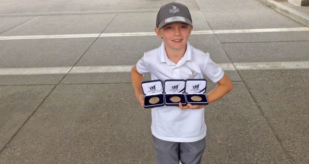 Timmy Hachey shows off his medals from the Drive, Chip and Putt competition in Portland, Ore. (Photo supplied)